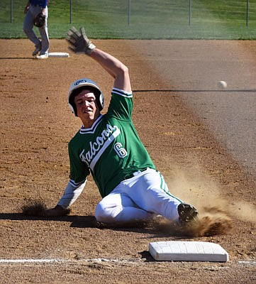 Nolan Hair of Blair Oaks slides into third base to beat a throw from the outfield during Monday's game against California at the Falcon Athletic Complex.