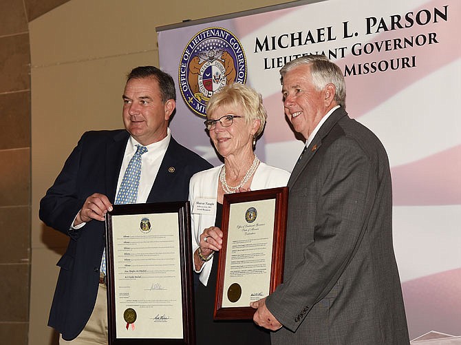 Sharon Naught was one of the winners of the Lieutenant Governor's Senior Service Award and was recognized Monday in the Capitol Rotunda. She was presented proclamations from Lt. Gov. Mike Parson, at right, and Sen. Mike Kehoe.