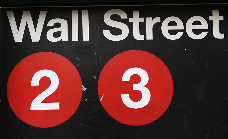 FILE - This Friday, Jan. 15, 2016, file photo shows a sign for a Wall Street subway station in New York.  Stocks are opening broadly higher on Wall Street, Wednesday, May 9, 2018, led by gains in energy companies as the price of crude oil moved back above $70 a barrel.  (AP Photo/Mark Lennihan, File)