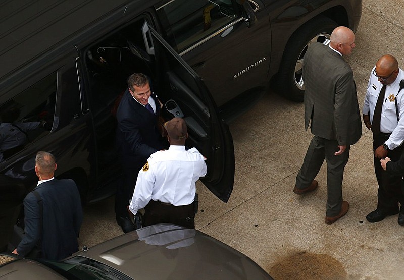 Missouri Gov. Eric Greitens, top, arrives at court for jury selection in his felony invasion of privacy trial, Thursday, May 10, 2018, in St. Louis. Greitens is accused of taking an unauthorized and compromising photo of a woman with whom he had an affair. (David Carson/St. Louis Post-Dispatch via AP)