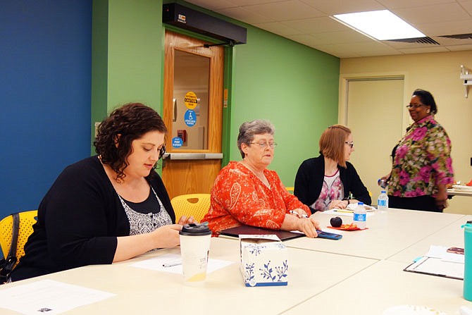 Members of the Daniel Boone Regional Library One Read Task Force — including Jill Mahoney, of William Woods University, left, Angela Grogan, of Westminster College, Rachel Utrecht, of WWU, and Sherry McBride, of Callaway County Public Library, among others — meet last year to discuss program ideas.
