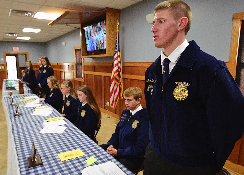 Mark Wilson/News Tribune
Corben Bonnett, Chaplain for the Blair Oaks FFA, addresses the 160 people attending their 1st Annual Banquet at the Wardsville Lions Club Wednesday evening. Seated next to Bonnett are other Blair Oaks FFA Officers.