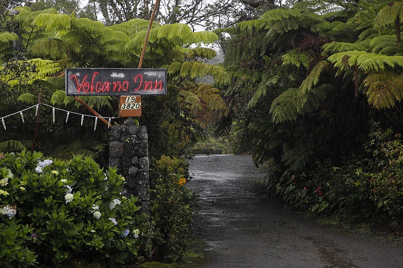 The entrance to Volcano Inn is photographed in Volcano, Hawaii, Thursday, May 10, 2018. The village is located on the border of Hawaii Volcanoes National Park, just a few miles east of Kilauea's summit crater. (AP Photo/Jae C. Hong)