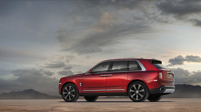 Rolls-Royce Cullinan is the bespoke British brand's first SUV and first AWD vehicle. It's powered by a 563-horsepower 6.75-liter twin-turbo V-12 engine. Pictured in Magma Red. It starts at $325,000. (Rolls-Royce/TNS)