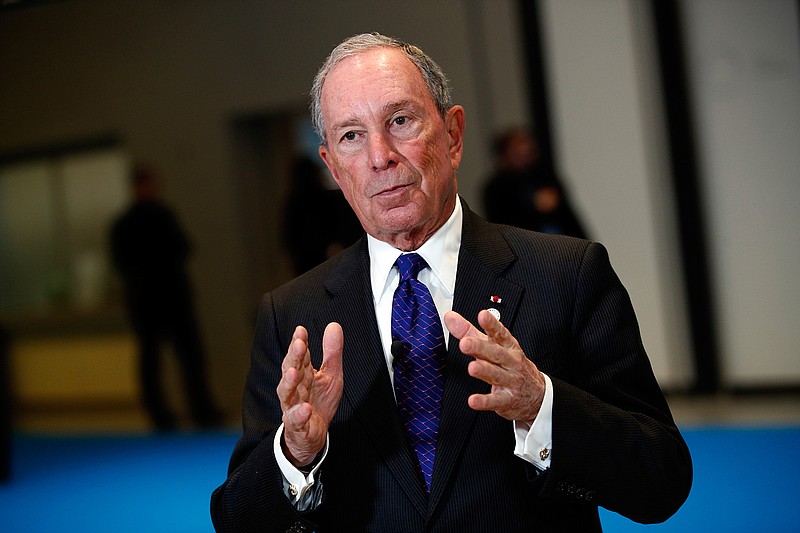 In this Dec. 12, 2017 file photo, Special envoy to the United Nations for climate change Michael Bloomberg addresses the media  at the One Planet Summit, in Boulogne-Billancourt, near Paris, France. Americans are facing an "epidemic of dishonesty" in Washington that's more dangerous than terrorism or communism. That's according to former the New York City Mayor who warned in a commencement speech on Saturday, May 12, 2018 at Texas' Rice University that "an endless barrage of lies" and a trend toward "alternate realities" in national politics pose a dire threat to U.S. democracy.  (AP Photo/Christophe Ena)