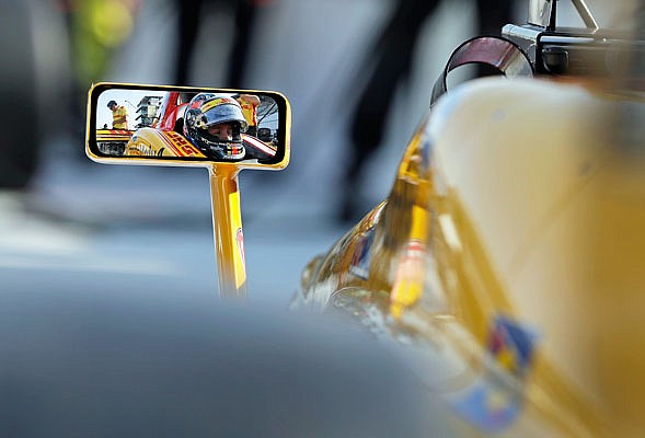 Ryan Hunter-Reay waits in his car before a practice session Friday for the IndyCar Grand Prix at Indianapolis Motor Speedway in Indianapolis.