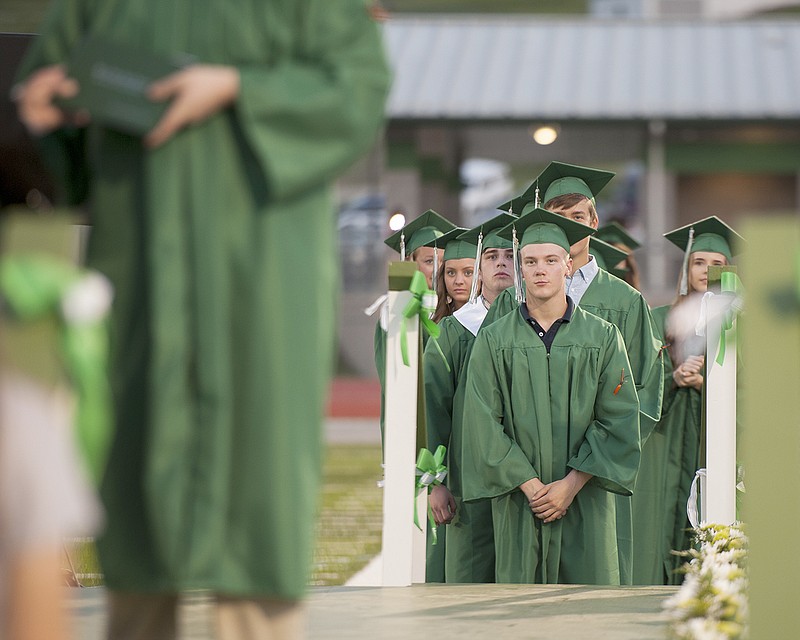 Tyler Gish stands at the front of the line of graduates waiting to walk across the stage and receive his diploma Sunday during the Blair Oaks High School Commencement Ceremony at Blair Oaks Athletic Complex. Gish was one of 90 graduating seniors making up the 50th class to graduate from Blair Oaks, also known as the "Golden Class."