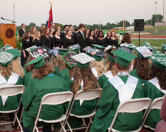 
Members of the Blair Oaks High School Class of 2018 listen as the school's Select Choir sings "Something Told the Wild Geese" during the commencement ceremony held at Falcon Athletic Complex on Sunday, May 13, 2018.