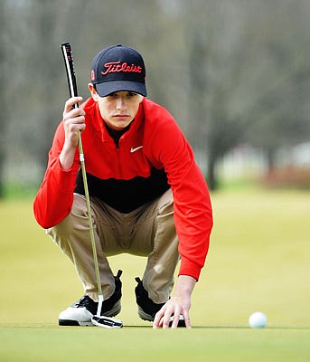 Michael Davidson of Jefferson City studies the a putt during last month's Capital City Invitational at Meadow Lake Acres Country Club. Davidson is one of four Jays who will play today and Tuesday in the Class 4 state tournament.