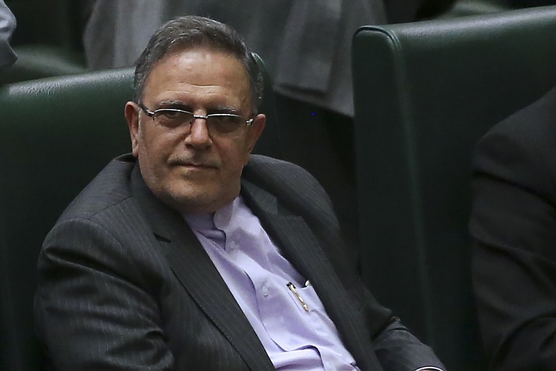 In this Aug. 20, 2017 photo, Iran's Central Bank Governor, Valiollah Seif, sits in an open session of parliament in Tehran, Iran. The United States escalated its financial pressure on Iran Tuesday, May 15, 2018 by slapping terror sanctions on the head of its central bank and barring anyone around the world from doing business with him, underscoring President Donald Trump's hard line after his withdrawal from the Iranian nuclear accord upset European allies. (AP Photo/Vahid Salemi)
