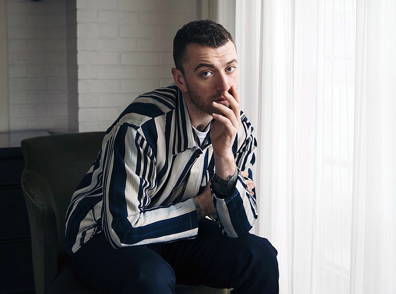 FILE - In this Nov. 2, 2017 file photo, musician Sam Smith poses for a portrait in New York to promote his album, "The Thrill of It All." A study of hundreds of thousands of popular songs over the last three decades has found a downward sonic trend in happiness and an increase in sadness. Some songs with a low happiness index in 2014 include “Stay With Me” by Smith. (Photo by Victoria Will/Invision/AP, File)