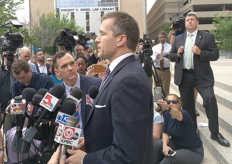 In this May 12, 2018 photo, Gov. Eric Greitens speaks at a news conference outside court in St. Louis.
