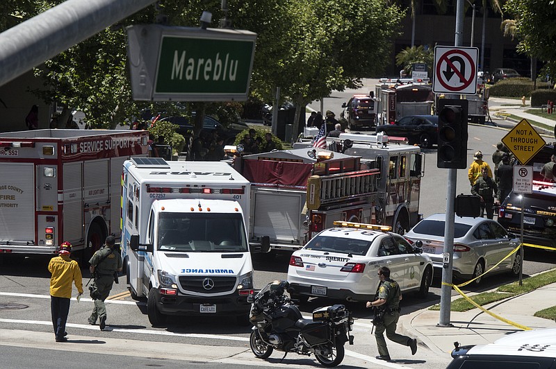 Orange County first responders investigate the scene of an explosion in Aliso Viejo, Calif., on Tuesday, May 15, 2018. The blast involved a building under renovation but the cause was not immediately known, according to authorities. (Mindy Schauer/The Orange County Register/SCNG via AP)