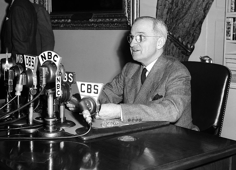 In this April 25, 1945, file photo, U.S. President Harry S. Truman speaks from a desk in Washington.