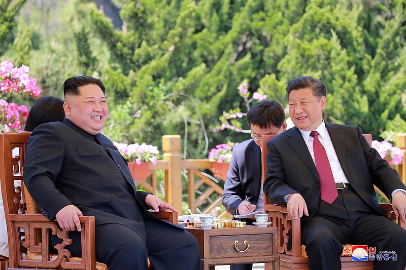 In this May 8, 2018, file photo provided by the North Korean government, North Korean leader Kim Jong Un, left, meets Chinese President Xi Jinping in Dalian, China.