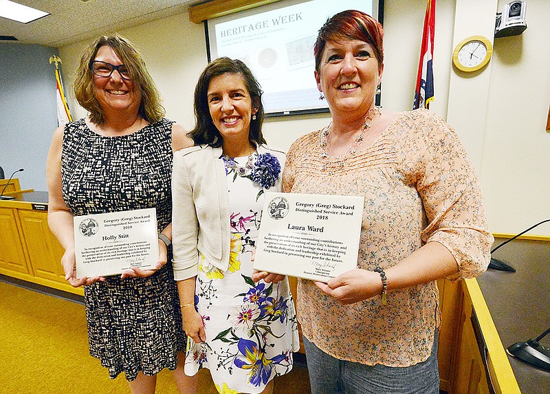 Mayor Carrie Tergin presents the Gregory Stockard award to Holly Stitt, left, and Laura Ward during The Historic City of Jefferson landmark awards at City Hall Tuesday.