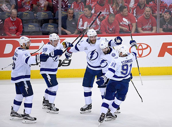 Lightning defenseman Victor Hedman (77) celebrates his goal with Nikita Kucherov (86), Steven Stamkos (91), Ondrej Palat (18) and Dan Girardi (5) during the second period of Tuesday's Game 3 of the NHL Eastern Conference finals against the Capitals in Washington.