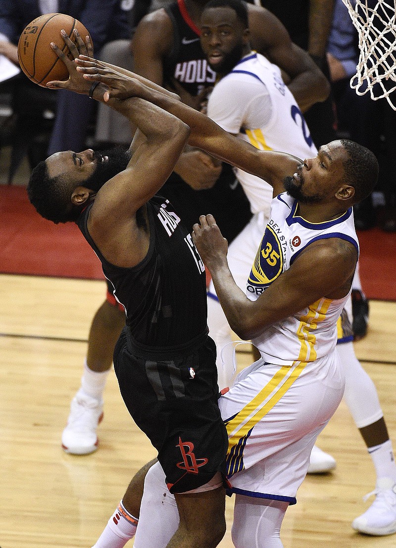 Golden State Warriors forward Kevin Durant (35) fouls Houston Rockets guard James Harden in the second half during Game 1 of the NBA Western Conference Finals, Monday, May 14, 2018, in Houston. (AP Photo/Eric Christian Smith)