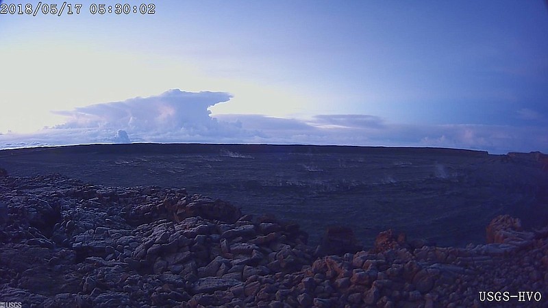 This photo provided by U.S. Geological Survey shows the ash plume at the Kīlauea Volcano, taken from a Mauna Loa webcam on Thursday, May 17, 2018 in Hawaii.  The volcano has erupted from its summit, shooting a dusty plume of ash about 30,000 feet into the sky. Mike Poland, a geophysicist with the U.S. Geological Survey, confirmed the explosion on Thursday. It comes after more than a dozen fissures recently opened miles to the east of the crater and spewed lava into neighborhoods.   (U.S. Geological Survey/HVO via AP)