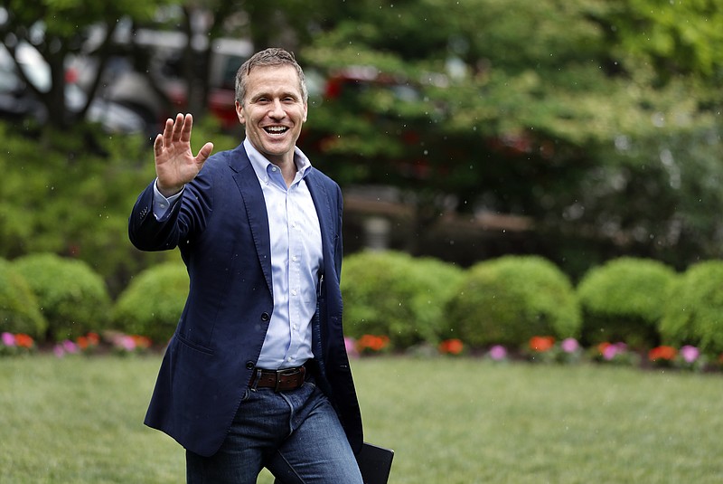 In this May 17, 2018 photo, Eric Greitens, as Missouri governor, waives to supporters as he walks to a podium in Jefferson City to make an announcement. (AP Photo/Jeff Roberson)