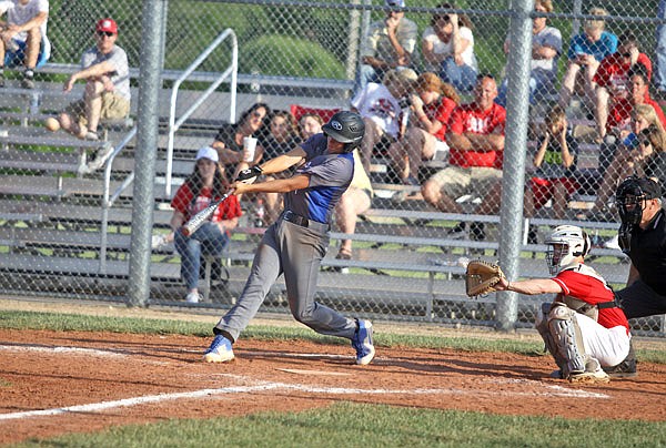 Russellville's Mason Stewart connects for an RBI single in the fourth inning against Harrisburg in the Class 2 District 7 Tournament championship game Wednesday at New Bloomfield.