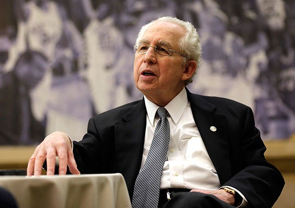 In this Oct. 25, 2012, file photo, Southeastern Conference commissioner Mike Slive talks with reporters during the SEC basketball media day in Hoover, Ala. Slive, the former SEC commissioner who guided the league through a period of unprecedented success and prosperity, died Wednesday. He was 77.