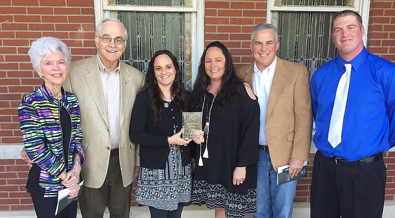 Shari Means' family accepts her award. From left: Jo James (mother), Charlie James (father and WWU board member), Megan Friday '06, MBA '08 (daughter), Mallory Morice '13 (daughter), Sam James MBA '98 (brother), and Matt Morice (son-in-law).