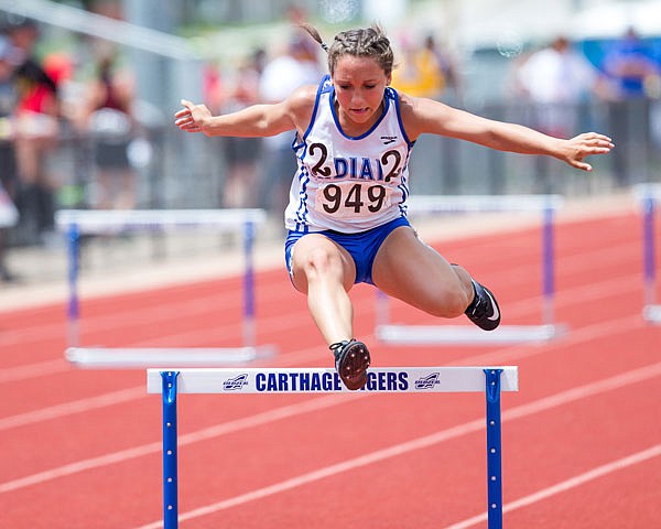 Russellville's Makenzie Schwartz clears a hurdle during last year's Class 1-2 state track and field championships at Adkins Stadium.