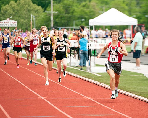 Emma Homfeldt of Calvary Lutheran leads the field to the finish line at the end of the Class 1 girls 800-meter run Friday at Adkins Stadium.
