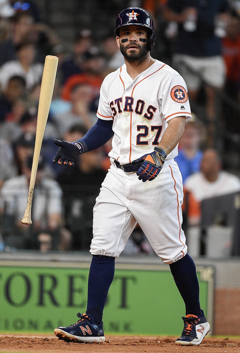 Houston Astros' Jose Altuve walks to the dugout after striking out during the fourth inning of a baseball game against the Cleveland Indians, Saturday, May 19, 2018, in Houston. (AP Photo/Eric Christian Smith)