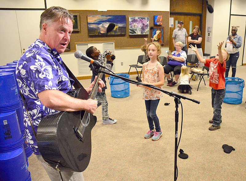 Babaloo performs his brand of high energy and fun music Saturday for youngsters and parents attending the Summer Reading program kickoff celebration at the Missouri River Regional Library.