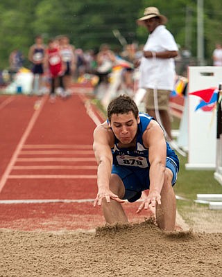 Trenton Barbour of Jamestown lands in the pit during the Class 1 boys triple jump competition Saturday at Adkins Stadium.