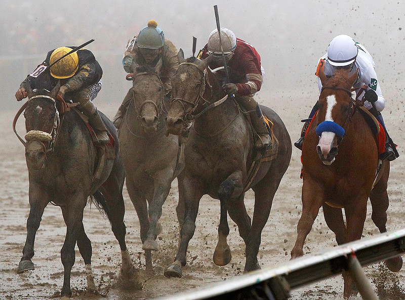 Justify with Mike Smith atop, right, wins the 143rd Preakness Stakes horse race at Pimlico race track, Saturday, May 19, 2018, in Baltimore. Bravazo with Luis Saez aboard, left, wins second with Tenfold with Ricardo Santana Jr. atop, second from right, places. (AP Photo/Steve Helber)