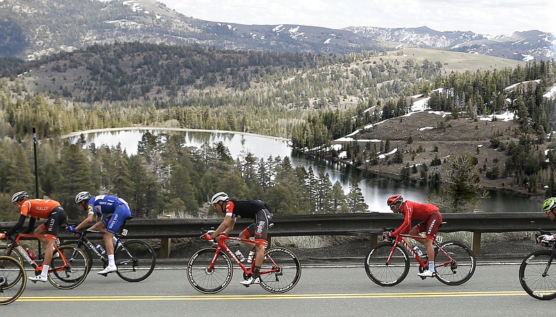 The peloton races down Highway 88 after crossing Carson Pass in the Central Sierra Nevada during the sixth stage of the Tour of California cycling race, near Kirkwood, Calif., Friday, May 18, 2018. (AP Photo/Rich Pedroncelli)