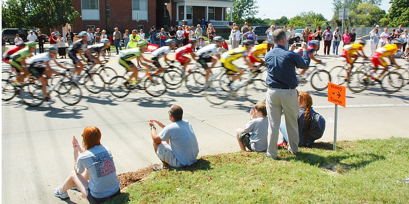 In this Sept. 14, 2007 photo, cyclists are a blur as they roll past spectators on Jefferson City's West Main Street in what was the first Tour of Missouri 600 mile race, an event which was staged for three years from 2007 to 2009.