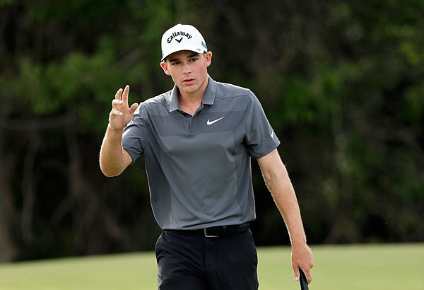 Aaron Wise acknowledges applause from the gallery after sinking a putt for birdie on the ninth hole during Sunday's final round of the AT&T Byron Nelson in Dallas.