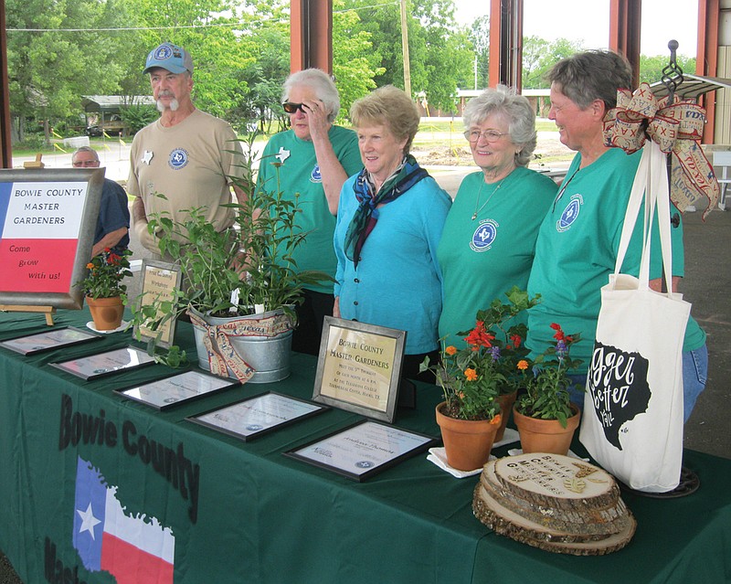  Bowie County Master Gardeners celebrate their 10th anniversary Sunday at New Boston's Trail Head Park. Five of the organization's charter members received the 10th anniversary recognition during the two-hour celebration. The recipients included, from left to right, Ken Kunkel; Mary Miller; Betty Hamilton, who accepted on behalf of her late husband, David Hamilton; Judy Klimaszewski and Andrea Thomas.