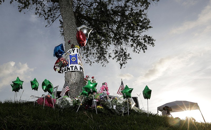A memorial can be seen in front of Santa Fe High School in Santa Fe, Texas. (Elizabeth Conley/Houston Chronicle via AP)