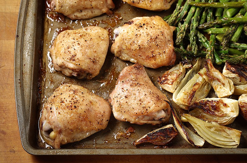 The chicken, asparagus and fennel all roast together on one baking sheet, making cleanup a breeze. (Abel Uribe/Chicago Tribune/TNS)