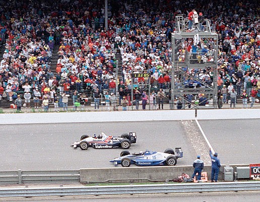 In this May 24, 1992, file photo, Al Unser Jr. (top) wins the Indianapolis 500 by less than a car length ahead of Scott Goodyear in the 76th running of the race at Indianapolis Motor Speedway.
