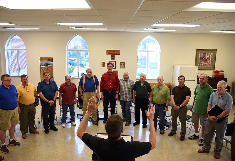 Emil Lippe/News Tribune
Director Reuben Phelps conducts the Monticello Singers during a rehearsal at Central United Church of Christ on Monday, May 21, 2018. The Monitcello Singers will perform 11 patriotic tunes in chronological order from the Revolutionary War through to more present day and ending with the Star Spangled Banner. 