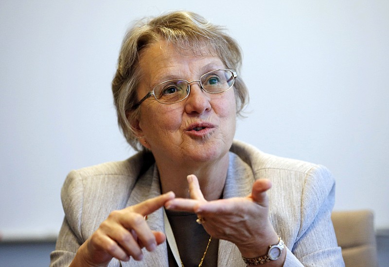 FILE - In this June 2, 2015, file photo, Diane Douglas, Arizona Superintendent of Public Instruction, meets with reporters in Phoenix. The Arizona Department of Education is considering changes to school science standards, including instances when it may remove or alter references to evolution. Douglas said the proposed changes reflect that parts of evolution are only theory. (AP Photo/Ross D. Franklin, File)