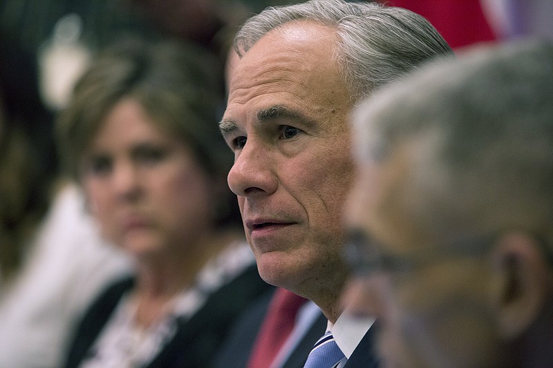 Gov. Gregg Abbott hosts a roundtable discussion about safety in Texas schools after the recent school shooting in Sante Fe at the Texas states Capitol on Tuesday, May 22, 2018, in Austin, Texas. Abbott convened the first in a series of discussions on school safety Tuesday. (Ana Ramirez/Austin American-Statesman via AP)