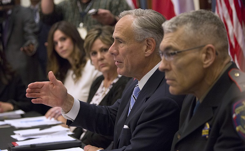 Gov. Gregg Abbott hosts a roundtable discussion about safety in Texas schools after the recent school shooting in Sante Fe at the Texas state Capitol on May 22, 2018, in Austin, Texas. Abbott convened the first in a series of discussions on school safety Tuesday. (Ana Ramirez/Austin American-Statesman via AP)