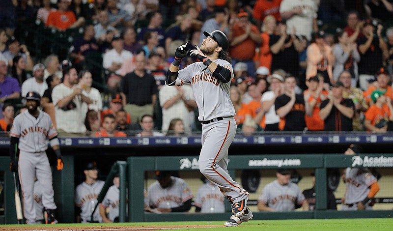 San Francisco Giants' Brandon Crawford reacts after hitting a two-run home run against the Houston Astros during the fifth inning of a baseball game Tuesday, May 22, 2018, in Houston. (AP Photo/David J. Phillip)