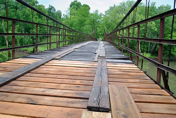 This May 2018 photo shows the Grand Auglaize Bridge, built in 1931 over the Grand Auglaize Creek, during a period when Miller County road crews were in the process of replacing floorboards.