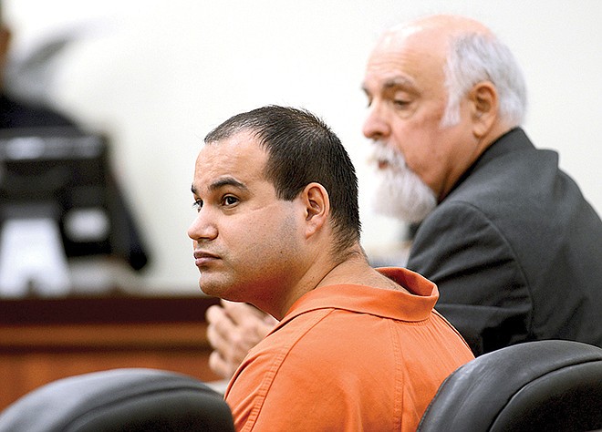 FILE - In this Nov. 5, 2013, file photo, John Allen Rubio, left, and his attorney, David A. Schulman listen during a court hearing in Brownsville, Texas. The Texas Court of Criminal Appeals rejected an appeal Wednesday, May 23, 2018, from Rubio, who is now on death row for stabbing and beheading his common-law wife's three children 15 years ago. 