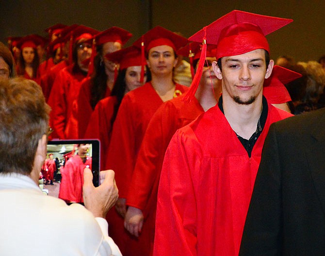 Mid-MO Adult Learning Center graduates file into the Miller Performing Arts Center in Jefferson City for commencement ceremonies Thursday evening, May 24, 2018. The ceremony also included the inaugural class of National Adult Education Honor Society inductees.