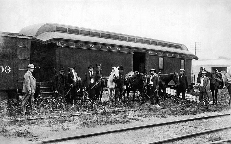 Deputy U.S. Marshal Joe LeFors, far right, poses for a photograph with the posse that set out to capture outlaws Butch Cassidy, Harry "the Sundance Kid" Longabaugh and the rest of the Wild Bunch gang after their robbery of a Union Pacific Railroad train in 1900 near Tipton, Wy. This image is engraved on a commemorative coin marking the 150th anniversary of the Union Pacific special agent force. Texarkana, Texas, Parks and Recreation Department employee Tammie Moore, LeFors' great-great-niece, recently found out about the coin when someone happened to give her supervisor one for his collection.