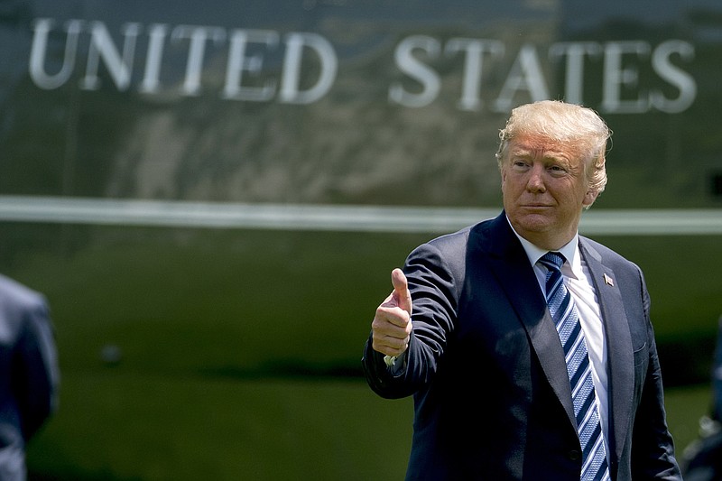 President Donald Trump give a thumbs up to members of the media as he arrives on the South Lawn of the White House in Washington, Friday, May 25, 2018, after attending a graduation and commissioning ceremony at the U.S. Naval Academy in Annapolis, Md. (AP Photo/Andrew Harnik)